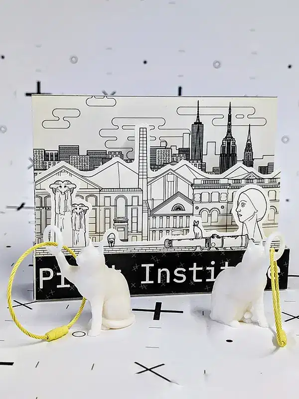 Assorted custom cards and keychains in various shapes and colors displayed on a tabletop