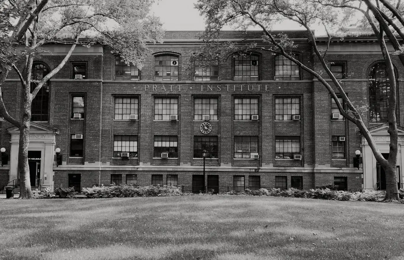 Exterior of Pratt Institute’s Engineering Building, a modern brick and glass structure with large windows.